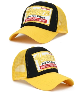 Close-up of Western New York Vintage embroidery on black and yellow trucker cap