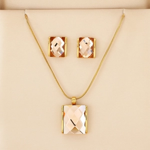 Detail of champagne square crystal pendant necklace and earrings set in gift box