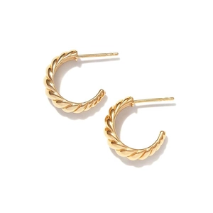 Detailed view of golden croissant hoop earrings with textured spiral twist on white background