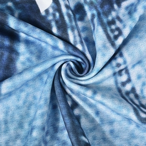Macro detail of breathable blue denim-print knit fabric with soft elastic texture