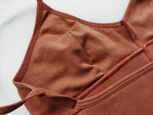 Macro detail of ribbed cotton sports bra with inner stitching and soft cup structure