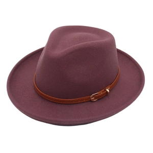 Classic plum wool fedora hat with brown leather band and gold buckle on white background