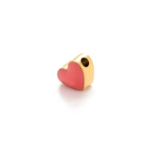 Close-up of pink enamel heart pendant with gold edges and side hole for DIY jewelry