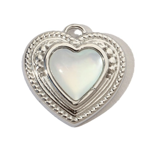Detailed view of heart-shaped silver pendant with white mother of pearl inlay