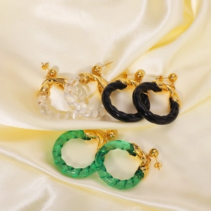 Acrylic spiral hoop earrings in white, black and green with gold-plated stainless steel posts
