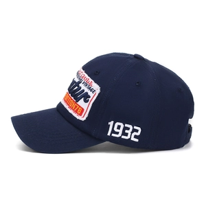 Dark blue washed cotton baseball cap featuring vintage patches and 1932 side embroidery