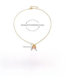 Detailed view of gold ballet shoe pendant necklace with size and weight measurements