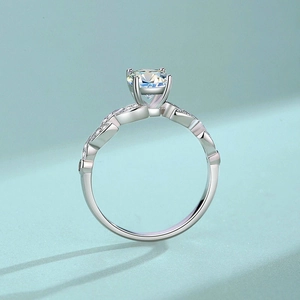 Elegant S925 sterling silver moissanite ring with four-prong setting and woven band details