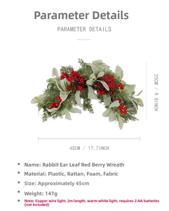 Close-up of Christmas swag with red berries, pine cones and warm copper wire lights