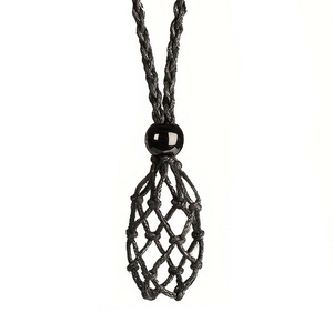 Detail of adjustable black woven cord necklace with crystal holder net pocket