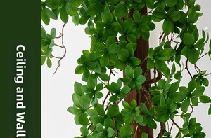Close-up of artificial green leaves with realistic wood-textured stems for wall decoration