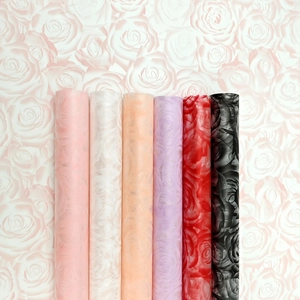 Close-up of waterproof floral wrapping paper rolls with elegant rose patterns in six colors