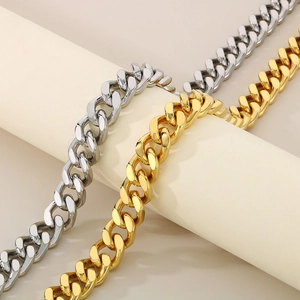 Macro shot of silver and gold plated Cuban link chains with CNC diamond setting details