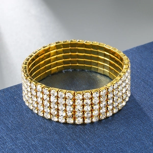 Macro shot of 5-row crystal stretch bracelet with sparkling rhinestones on gold base