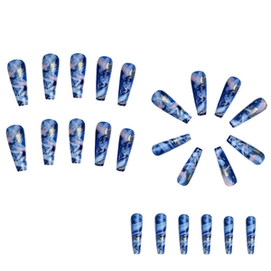 Blue and pink marble coffin nails with gold foil accents on a white background