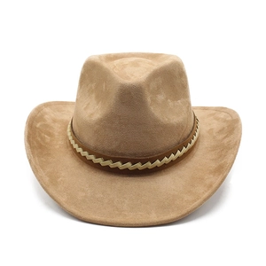 Detail of tan suede western cowboy hat featuring a textured gold woven decorative band