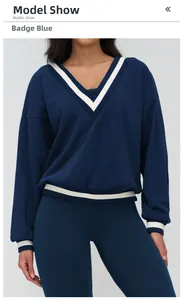 Detail view of V-neck sweatshirt with striped ribbed cuffs and hem in badge blue