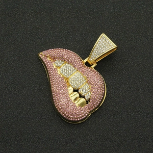 Macro shot of hip-hop large lips pendant with pink rhinestones and cuban chain link