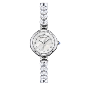 Detail of luxury women's watch featuring a mother-of-pearl dial and pearl crystal bracelet