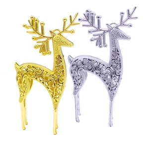Hollow gold and silver reindeer ornaments with intricate filigree for Christmas decor