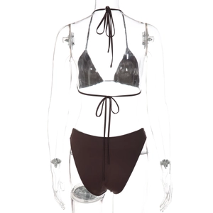 Detail view of dark brown bikini set back with neck and back tie straps on a mannequin