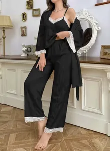 Detailed view of black three-piece pajama set with white eyelash lace and ribbed texture