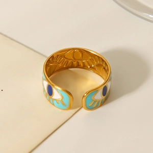 Detail of gold evil eye open ring featuring vibrant blue and white enamel inlay
