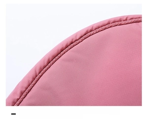 Detail shot of the pink nylon dumpling bag showing reinforced edges and 3D cut craftsmanship