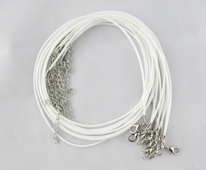 Close-up of white wax cord necklaces with silver lobster clasps and extension chains