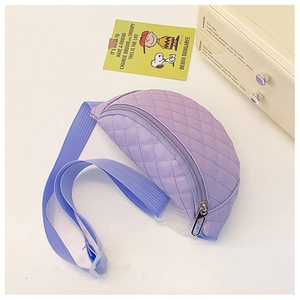 Detailed view of purple quilted chest bag with blue adjustable strap and buckle
