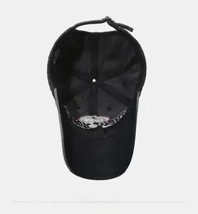 Detail of black cotton baseball cap interior featuring metal buckle and quality stitching