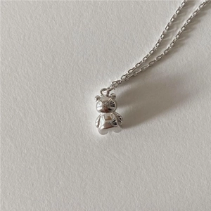 Close-up of S925 sterling silver hallmark on the back of a 3D teddy bear pendant necklace