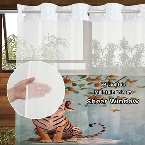 Detail of semi-transparent shower curtain with tiger floral print and metal ring top