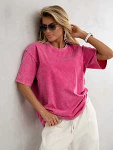 Detail of vintage washed rose red cotton T-shirt showing distressed fabric texture and fit