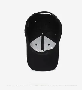 Detailed interior view of a black baseball cap showing the cotton twill and sweatband