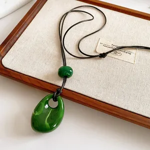 Vintage green glass waterdrop pendant on black cord necklace for women, ethnic jewelry