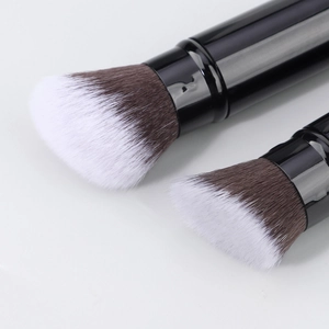 Detailed close-up of dual-tone synthetic fiber bristles on professional makeup brushes