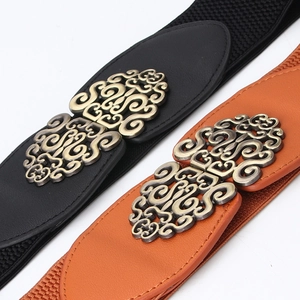 Black and brown vintage elastic waist belts with retro floral engraved metal buckles