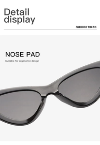 Detail showing the ergonomic nose pad on high-gloss black cat-eye sunglasses