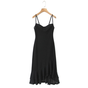Detail showing the ruffled irregular hemline of this elegant black chiffon maxi dress