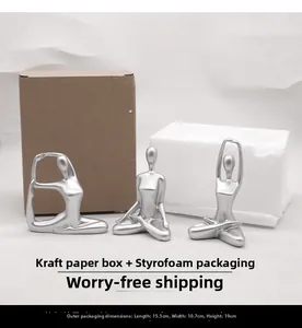 Three silver yoga sculptures with matte finish and packaging box size 15.5x10.7x19cm