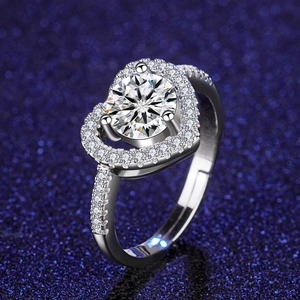 Macro detail of heart-shaped halo ring with round brilliant cut stone and adjustable band