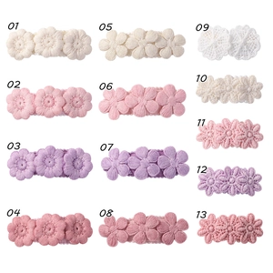 Detailed collection of embroidered floral hair clips in thirteen pastel colors and styles