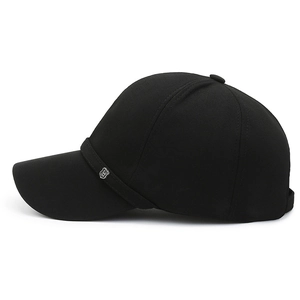 Classic black baseball cap with silver metal logo and ribbon detail on white background