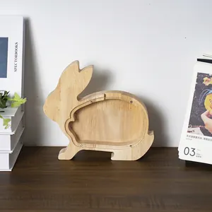 Detail of bunny-shaped wooden money bank with transparent acrylic panel and metal screws