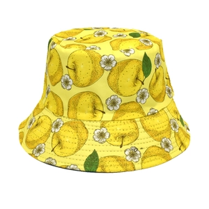 Close-up of yellow bucket hat featuring pear patterns and white floral prints for women