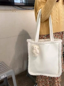 Vintage solid color faux shearling tote bag with leather patchwork and bear charm accessory