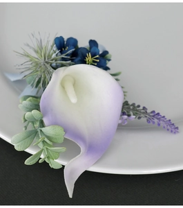 Detailed view of handmade white and purple calla lily boutonniere for weddings