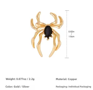 Detailed view of gothic golden spider ear cuff with a black marquise gemstone inlay