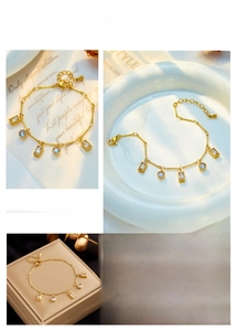 Detailed collage of gold link bracelet with rectangular and round blue gems on vintage paper